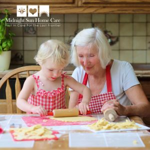 Grandmother and granddaughter preparing cookies in the kitchen