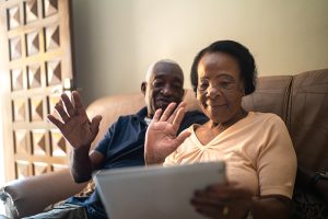 Senior couple on a video calling using a digital tablet at home